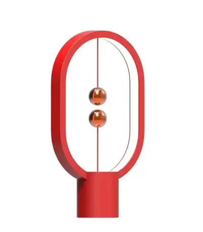 Lampe Newton en verre rouge avec cadre ovale en métal, design moderne et scientifique, idéale pour décoration de bureau ou salon.