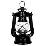 Candeeiro de óleo antigo com estrutura de metal preta, vidro transparente na câmara de combustão, alça superior e suporte para vela ou óleo.