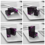 Conjunto de cubos de aço preto com padrão de manchas de tinta rosa, exibidos de diferentes ângulos sobre um teclado de portátil.