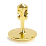 Giroscópio miniatura dourado com base circular e estrutura cilíndrica com orifícios, visto de frente.