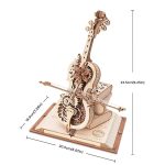 Modelo de instrumento musical em madeira com engrenagens visíveis, base de livro e dimensões indicadas, mostrando detalhes do mecanismo interno.