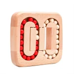 Quebra-cabeças de bolas de madeira vermelhas e brancas, formando um padrão de letras com encaixe.