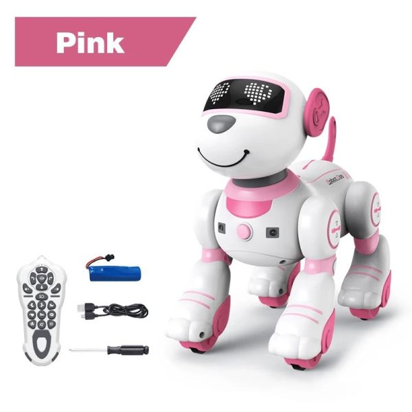 Cão robô de cor rosa e branco com olhos digitais, rodas e acessórios, incluindo comando remoto, bateria e ferramenta de carregamento.
