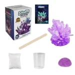 Conjunto de materiais para criar cristais de ametrino, incluindo uma caixa, uma colher de madeira, um cristal roxo, um copo de plástico, um saco de reagentes e um manual.
