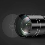 Lente de telescópio com medidor de distância de 70mm, mostrada de lado com foco ajustável e detalhes metálicos.
