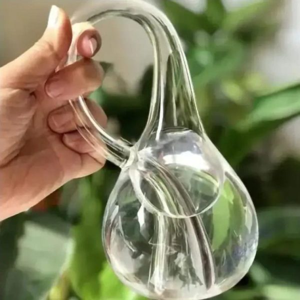 Pipeta de vidro em forma de pêra, usada para experiências de laboratório ou decoração científica.