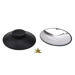 Lupa de mesa com base preta e suporte ajustável, acompanhada de pequena figura de um alienígena dourado, vista de cima.