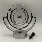 Sistema de plasma de mesa com estrutura metálica brilhante, componentes circulares e fios elétricos ao lado, usado para demonstrações científicas.