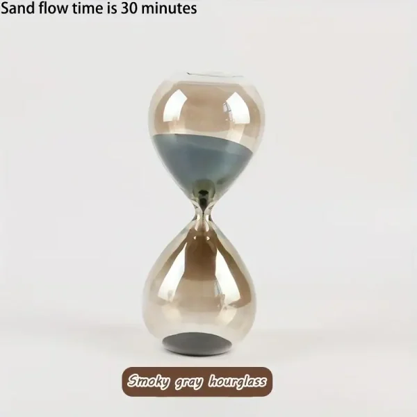 Relógio de areia com areia cinza fumado, mostrando o fluxo de areia durante 30 minutos, com forma de ampulheta clássica.