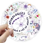 Adesivo com desenho de neurónio e texto "Neurobiologists have a lot of nerves" em português, com fundo de outros adesivos científicos.