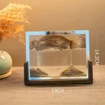Estrutura de vidro com areia e água, mostrando diferentes camadas e níveis de água, medindo 14,2 cm de altura e 19 cm de largura.