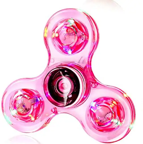 Fidget spinner de plástico transparente rosa com três braços, cada um com uma esfera de LED colorido que ilumina ao girar.
