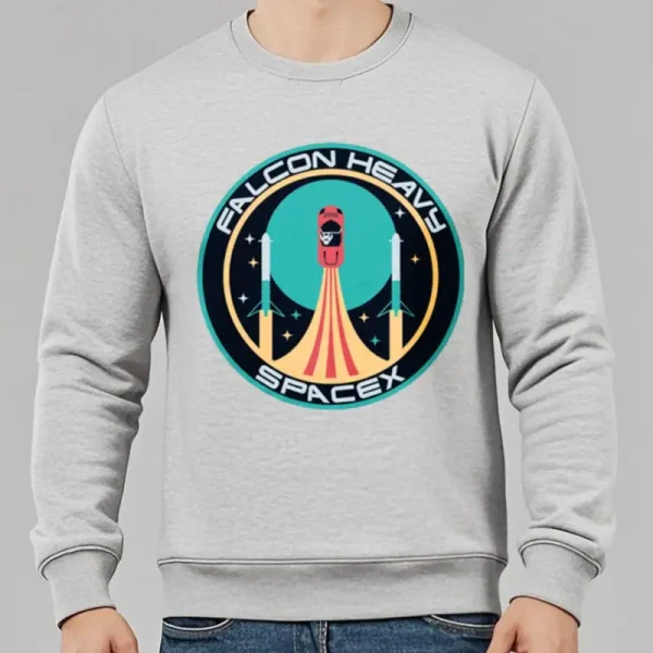 Sweatshirt cinza com logotipo Falcon Heavy SpaceX, ilustração de um foguete em lançamento num estilo gráfico moderno, ideal para entusiastas do espaço e tecnologia.