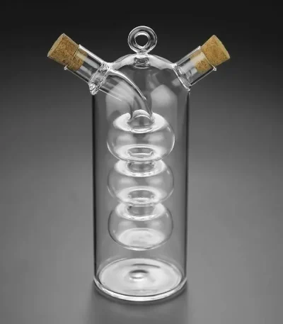 Vaso de vidro científico com duas rolhas de cortiça, ideal para a decoração ou utilização em laboratório. O seu design elegante e transparente faz dele um objeto decorativo único para os amantes de ciência.