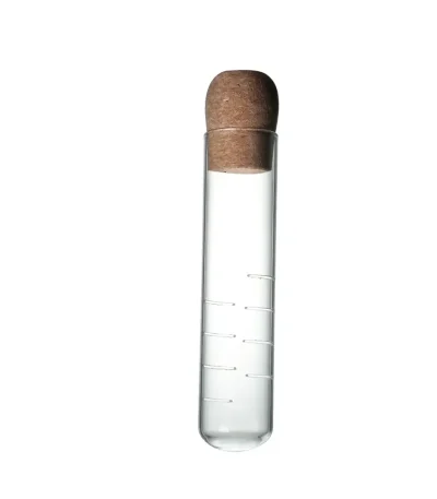 Pipeta em vidro com tampa de cortiça, usada para experiências científicas ou como objeto de decoração científica.