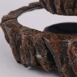 Círculo decorativo em pedra natural com superfície texturizada e acabamento polido, ideal para decoração interior ou exterior, trazendo um toque elegante e natural ao seu espaço.