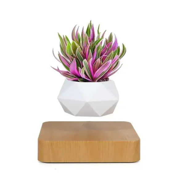 Planta artificial em vaso branco com folhas verdes e rosas, decoração moderna e científica.