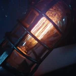 Lâmpada Edison vintage em uma moldura de metal preto, iluminando um ambiente com uma luz quente e acolhedora.