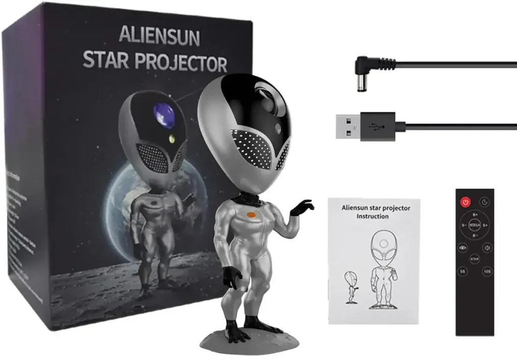 Projetor de estrelas AlienSun com figura de extraterrestre, cabo USB e controle remoto, ideal para decoração científica e ambiente cósmico.