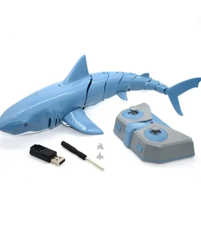 Tubarão robô educativo em plástico azul com controle remoto, pen drive e acessórios para aprendizagem interativa.
