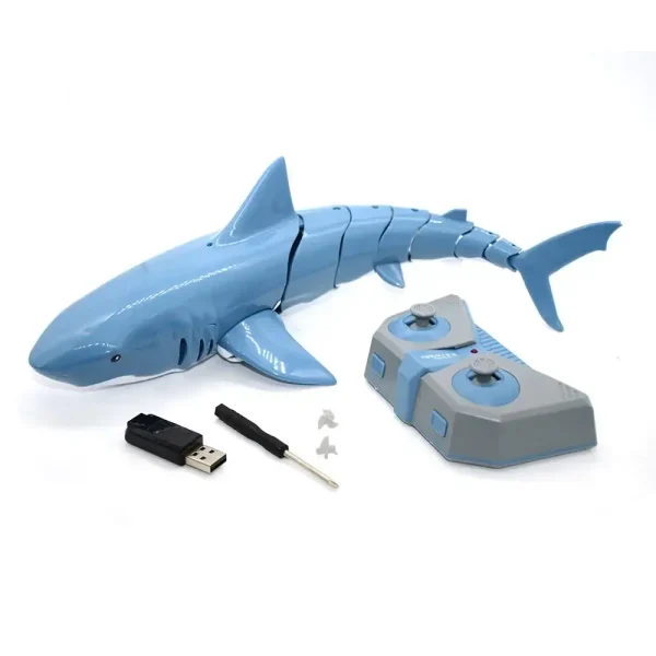 Tubarão robô educativo em plástico azul com controle remoto, pen drive e acessórios para aprendizagem interativa.