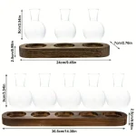 Vaso de vidro transparente com base de madeira, ideal para decoração de estilo científico ou laboratório. Dimensões precisas para um resultado elegante e moderno.
