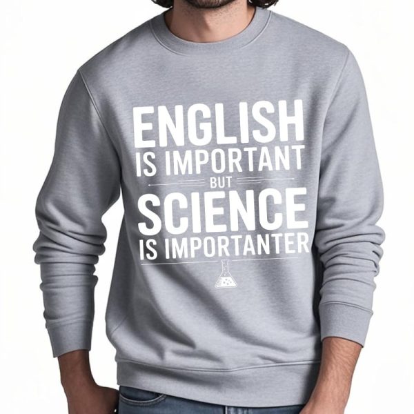 Camisola cinza com mensagem humorística sobre a importância da ciência em relação ao inglês, ideal para amantes de ciências e humor.