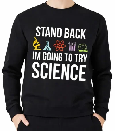 Um casaco com capuz preto com o texto "Stand Back, I'm Going to Try Science" e ícones de laboratório coloridos, ideal para os amantes de ciência e decoração científica.