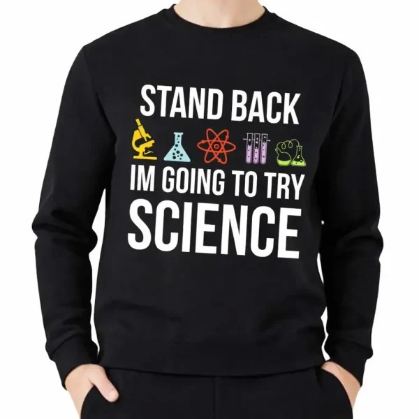 Um casaco com capuz preto com o texto "Stand Back, I'm Going to Try Science" e ícones de laboratório coloridos, ideal para os amantes de ciência e decoração científica.